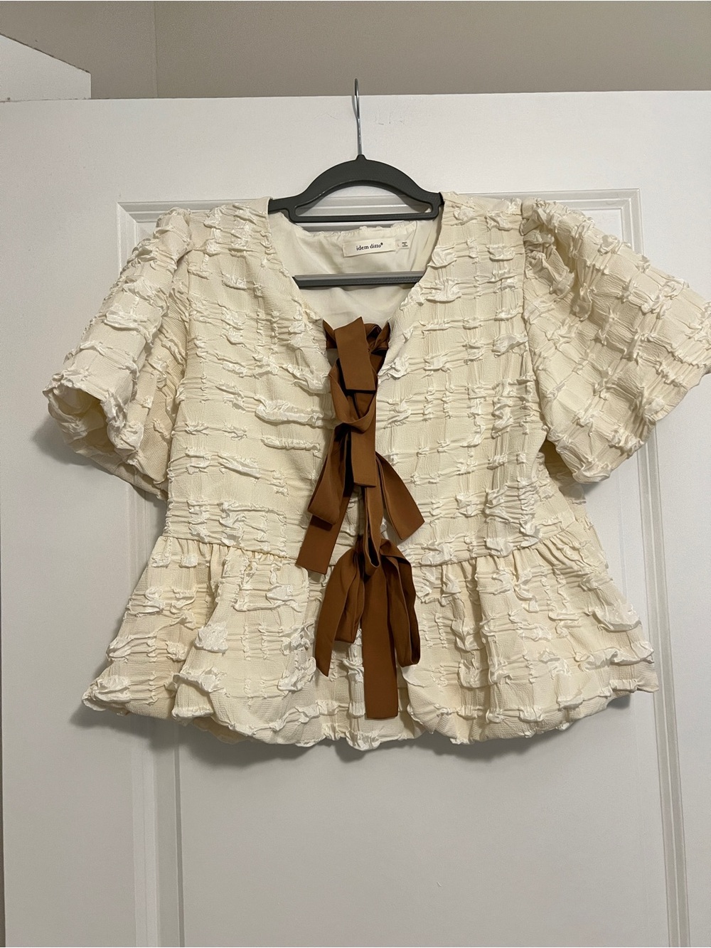 Women's Cream Textured Peplum Blouse with Brown Ribbon Tie